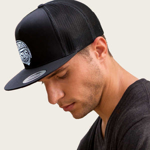 man wearing bomonster avatar logo hat